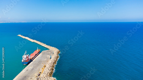 Aerial Image over port with large boat in Mediterranean sea.