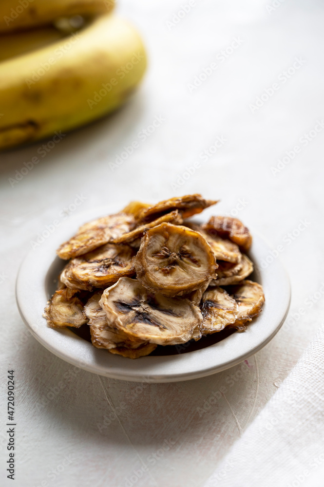 Banana chips. Homemade organic dried banana healthy snack