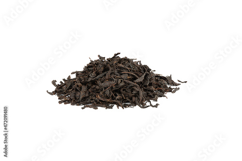 Large dry black tea leaves isolated on white background.
