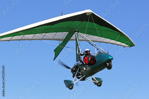 Valokuva Ultralight airplane flying in a blue sky