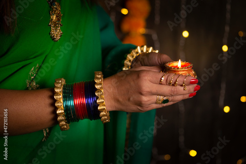 Woman holding Diya 