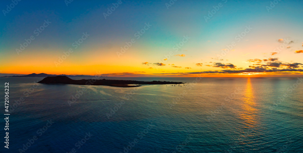 Panoramic view of the sunrise over Isla de Lobos island Fuerteventura