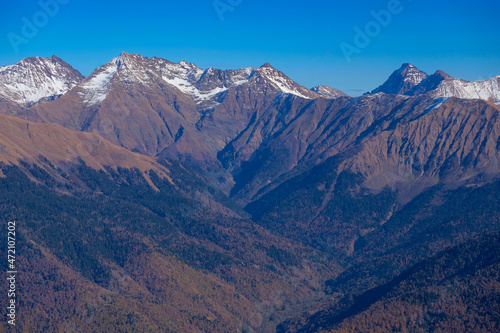 Fototapeta Naklejka Na Ścianę i Meble -  Autumn mountains with snowy peaks in the Caucasus