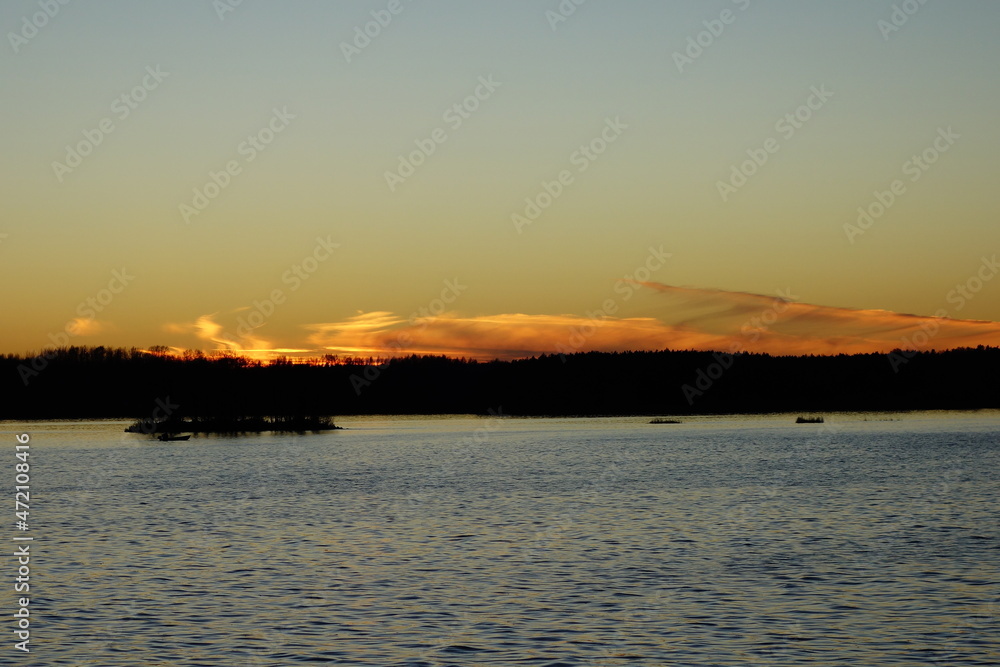 Naklejka premium sunset over the river