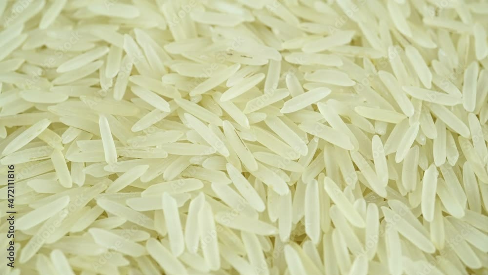 Raw Rice Basmati Rotating Top View Under Macro. Raw Rice Basmati Rotating Top View Under Macro.