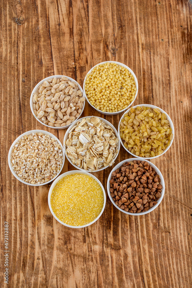 Large group of wholegrain food shot on rustic wooden table Large group of wholegrain food shot on rustic wooden table