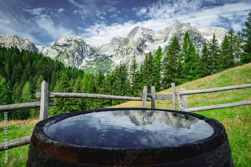 Scenic view of Totes Gebirge mountainrange with reflections on water in a barrel