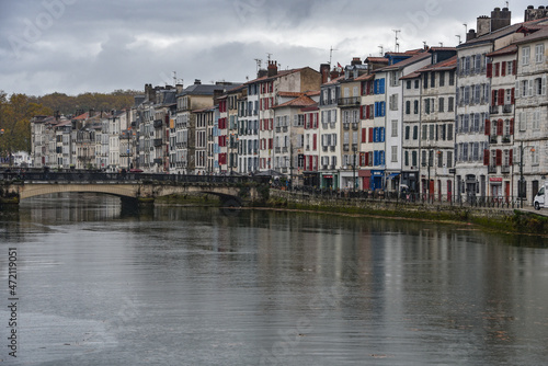 BAYONNE  FRANCE - 30 Oct  2021  Old houses by the river La Nive in the center of Bayonne  Aquitaine  France