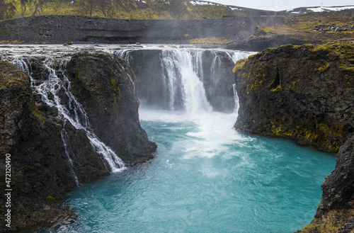 Picturesque waterfall Sigoldufoss autumn view. Season changing in southern Highlands of Iceland. photo