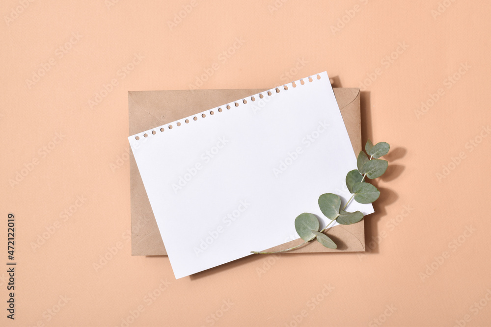 The minimum layout of a letter with an envelope on a blue background with eucalyptus The minimum layout of a letter with an envelope on a blue background with eucalyptus