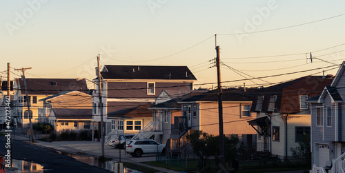 Power lines and shore houses at sunrise on the New Jersey shore.