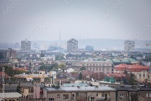 Skyline of New belgrade  or novi beograd  in Serbia  since from Zemun  with bruatlist residential skyscraper towers blurred due to an autumn foggy rain. Novi beograd is business district of Belgrade