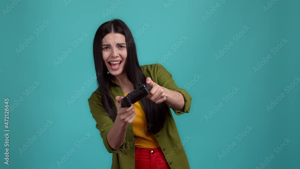 Sad lady lose game throw joystick scream isolated dark cyan color background Sad lady lose game throw joystick scream isolated dark cyan color background