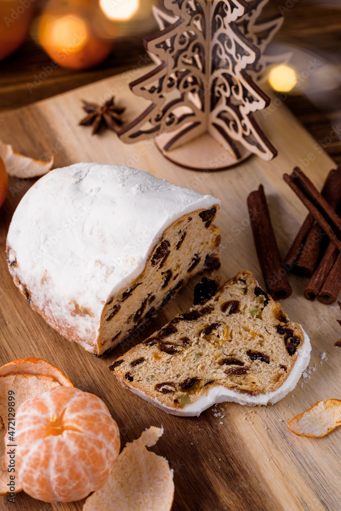 german christmas cake stollen with spices, tangerines and decor german christmas cake stollen with spices, tangerines and decor