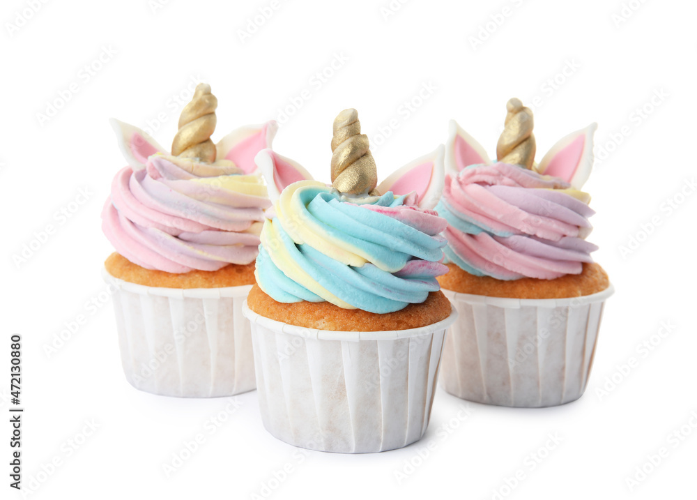 Three cute sweet unicorn cupcakes on white background