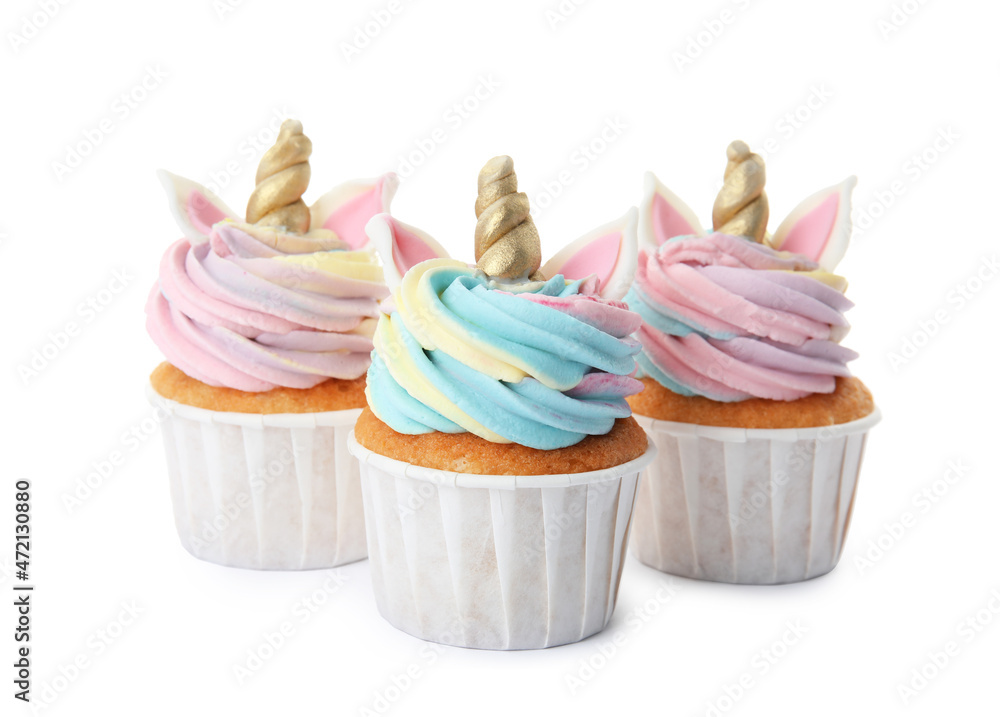 Three cute sweet unicorn cupcakes on white background Three cute sweet unicorn cupcakes on white background