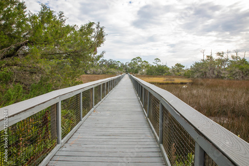 An elevated boardwalk over the salt marsh at Fort Mose Historic State Park.  © Linda