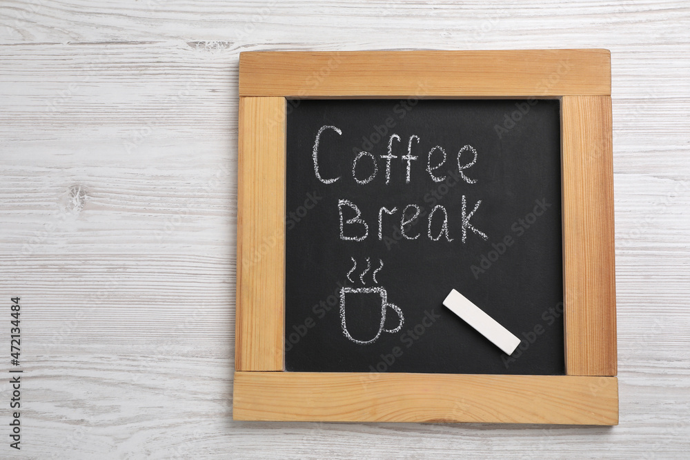 Blackboard with phrase Coffee Break and piece of chalk on white wooden table, top view Blackboard with phrase Coffee Break and piece of chalk on white wooden table, top view