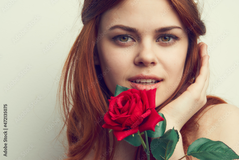 beautiful red-haired woman rose flower close-up charm beautiful red-haired woman rose flower close-up charm