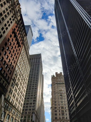Looking up at the tall buildings along Broadway in downtown Manhattan, New York City