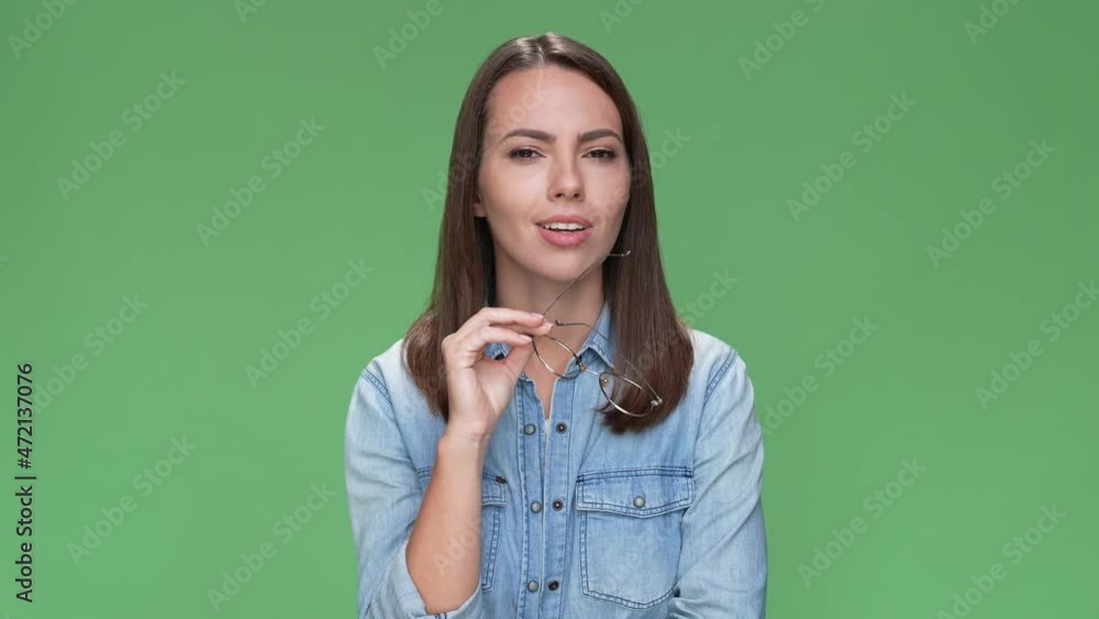 Pensive lady think deep solution no answer isolated green color background Pensive lady think deep solution no answer isolated green color background