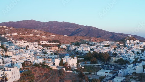 The Church or Cathedral of Panagia Gremiotissa is located high in the Chora ahead of sunset. ios chora one corner of the beautiful country of Greece. aerial view of lux villas in ios chora. photo