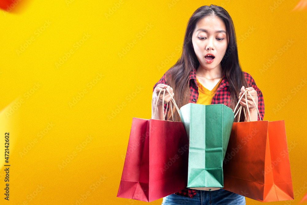 Asian woman carrying shopping bags