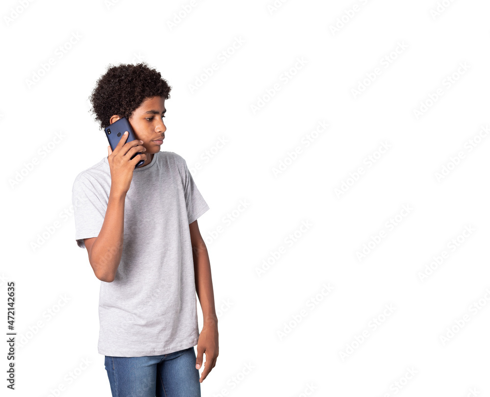 A adolescent afro latino talking by cell wearing a gray t-shirt A adolescent afro latino talking by cell wearing a gray t-shirt
