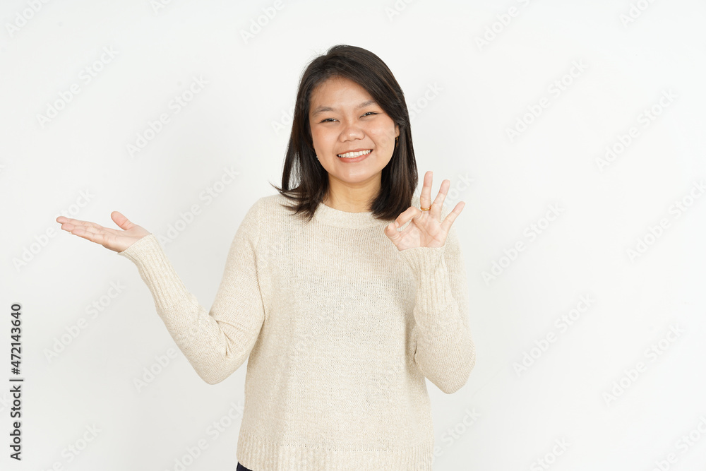 Showing recommended product on open palm of Beautiful Asian Woman Isolated On White Background Showing recommended product on open palm of Beautiful Asian Woman Isolated On White Background