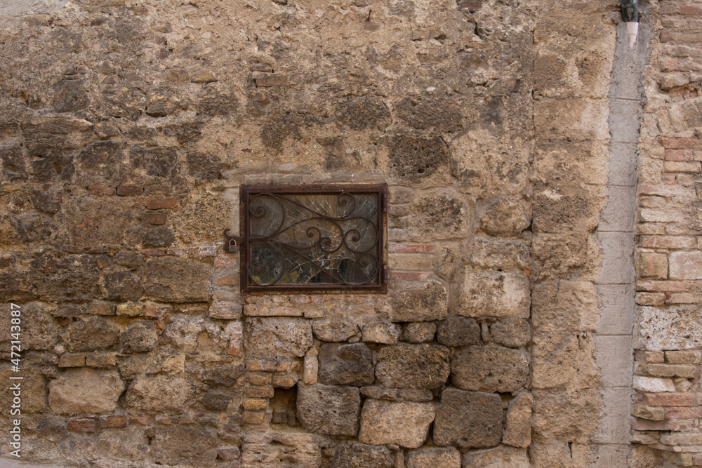 old stone wall with window