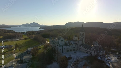 Beautiful Canadian Landscape And The Famous St. Benoit du Lac Church In Sunset - aerial shot photo