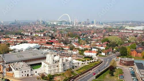 Neasden Temple in Brent, London with Wembley Stadium. BAPS Shri Swaminarayan Mandir is one of the largest Hindu temples outside of India. photo