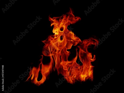 Flame Flame Texture For Strange Shape Fire Background Flame meat that is burned from the stove or from cooking. danger feeling abstract black background Suitable for banners or advertisements. © sainan