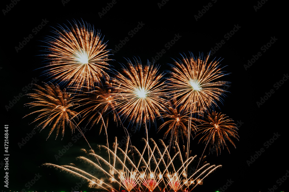 Beautiful Fireworks on the sky background. New year concept 2022.
Fireworks festival 2021 on the beach at Pattaya in Thailand.