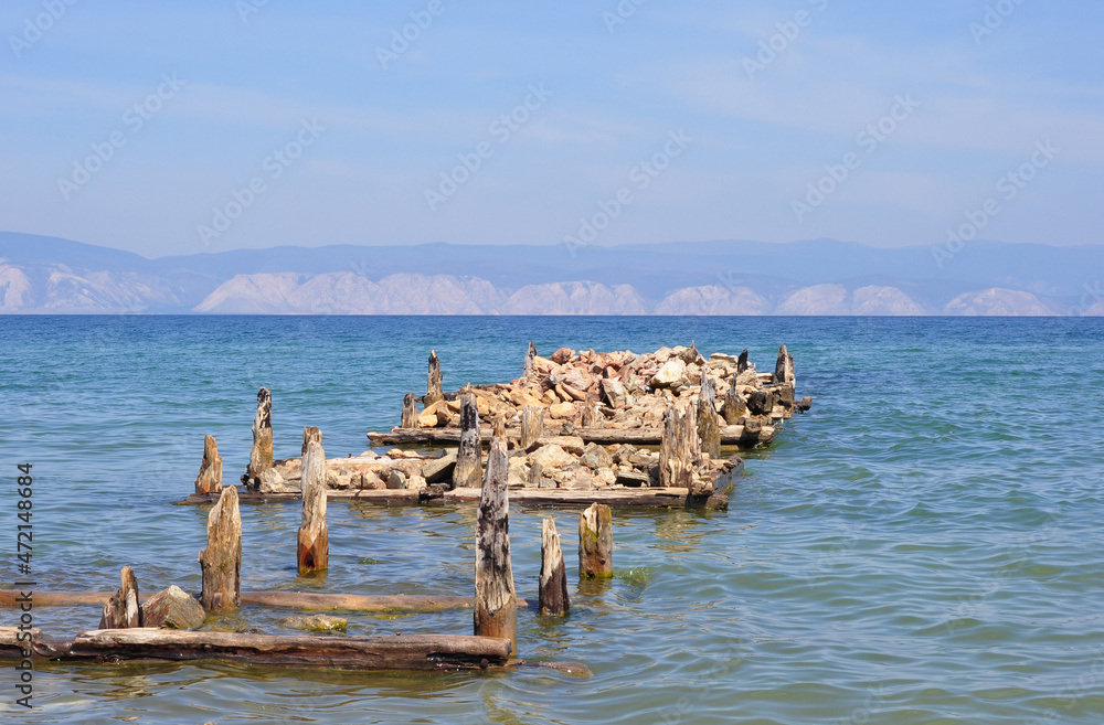 Old abandoned pier of fish factory, Olkhon Island, Peschanoe tract, sand beach, Baikal lake