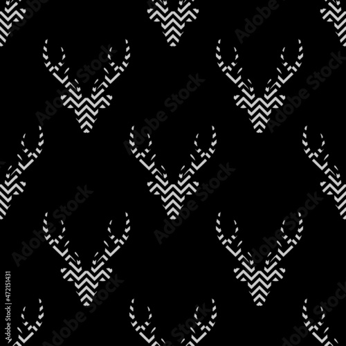 seamless winter mosaic pattern with deer head with antlers. simple striped geometry design style.