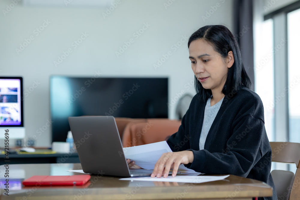 Portrait of Asia women using laptop for work Portrait of Asia women using laptop for work