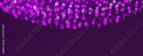 Holiday border of Purple bokeh lights