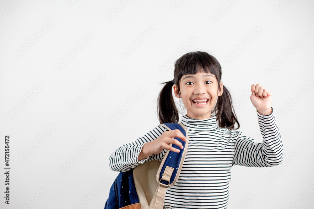 Portrait of Asian child in school uniform with school bag on white background Portrait of Asian child in school uniform with school bag on white background