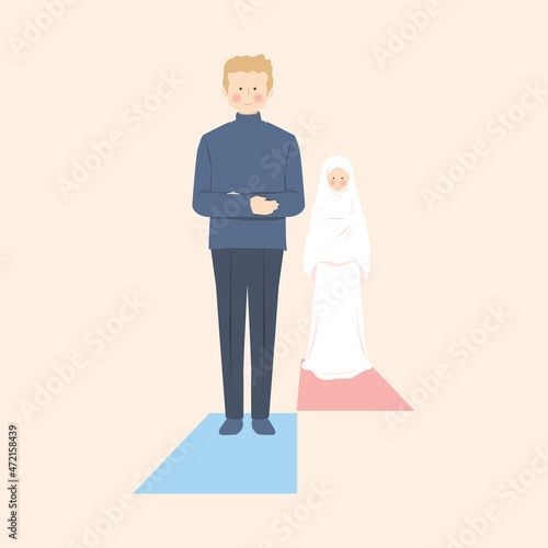 Muslim man and woman pray salat in jamaah