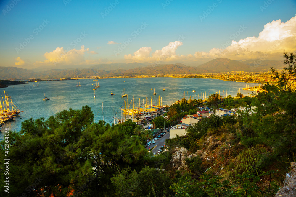 FETHIYE, TURKEY: View of the harbor with numerous yachts, and beautiful mountains.