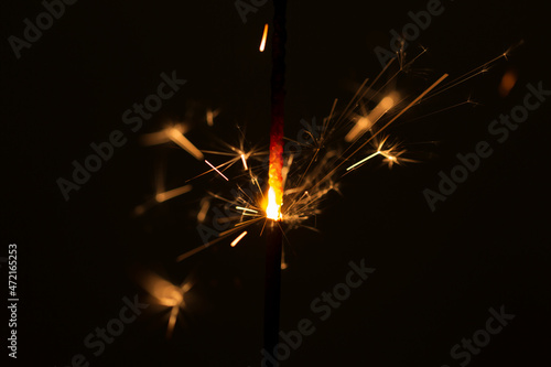 Burning sparkler in the dark  close up  Christmas European tradition