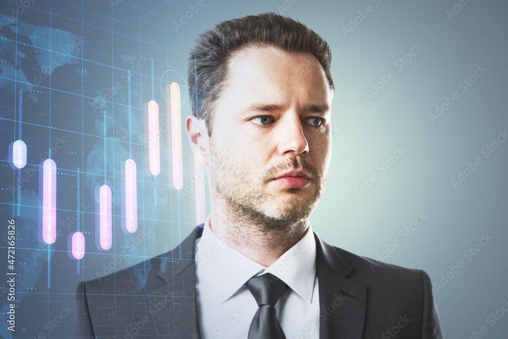 Portrait of handsome young european businessman thinking about candlestick forex graph and map on gray background with mock up place. Trade, economy and growth concept. Double exposure. Portrait of handsome young european businessman thinking about candlestick forex graph and map on gray background with mock up place. Trade, economy and growth concept. Double exposure.