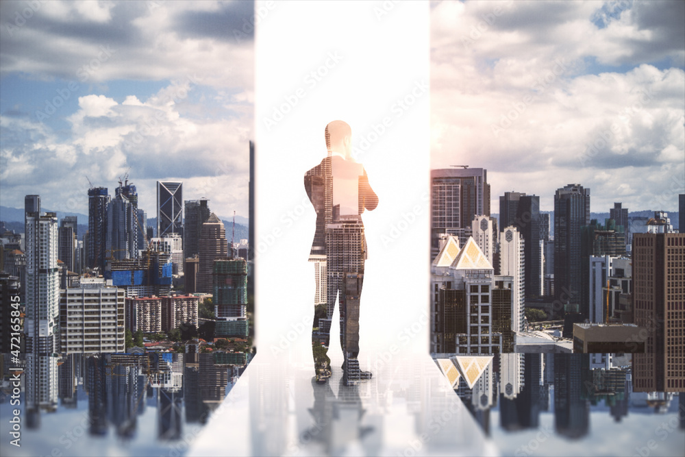 Creative image of male standing on city background. Success, growth and future concept. Double exposure. Creative image of male standing on city background. Success, growth and future concept. Double exposure.