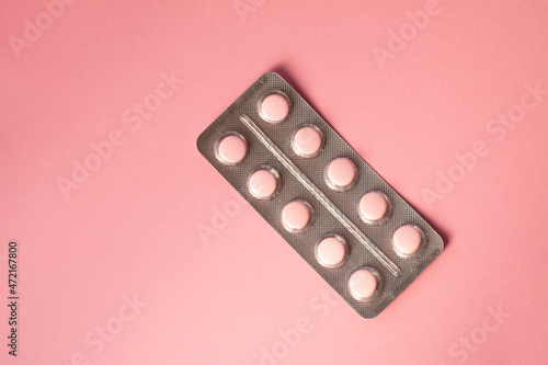 Wallpaper Mural Pink pills in a blister pack on a pink background.  Torontodigital.ca
