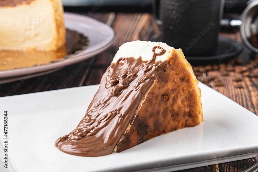 Fototapeta premium San Sebastian Cheesecake with Chocolate Poured on it
