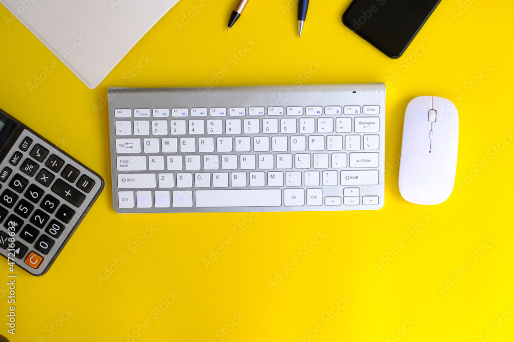 Office desk table with laptop, supplies and tablet. Top view with copy space, banking and finance concepts, web, wireless, work, workplace Office desk table with laptop, supplies and tablet. Top view with copy space, banking and finance concepts, web, wireless, work, workplace