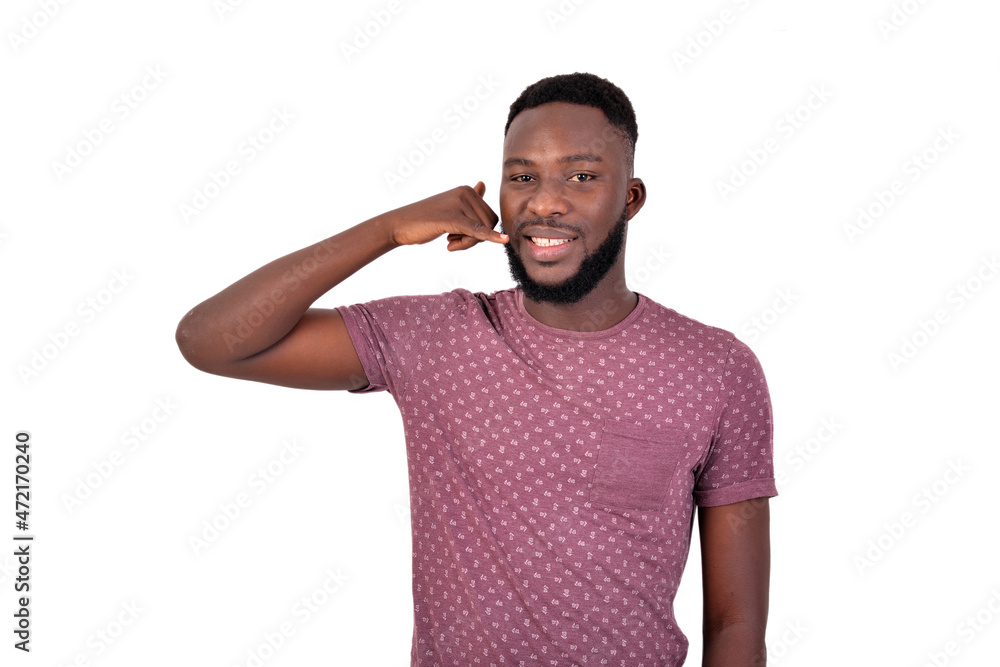 young man making phone gesture with fingers smiling. young man making phone gesture with fingers smiling.