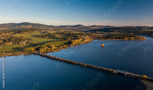 The Lipno Reservoir is a dam and hydroelectric plant constructed along the Vltava River in the Czech Republic. This area is mountainous, and borders the Sumava National Park and Nature Reserve photo