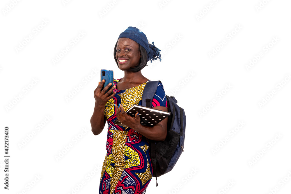 young student girl holding a mobile phone smiling. young student girl holding a mobile phone smiling.